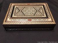 Top angled view of rectangular Persian Khatam trinket box with intricate micro mosaic inlaid wood design.
