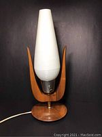 Front view of lamp unlit showing overall form and finish