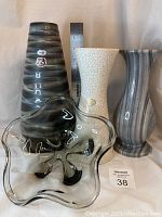 Full view of all four pieces: three vases and one smoked glass bowl, with ruler for height reference.