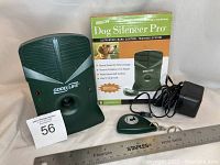 Device, remote, adapter, and box all together with pricing tag and ruler for size reference.