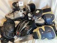 Lot showing entire rollerblade and protective gear package including rollerblades, wrist and elbow guards, knee pads, and helmet.