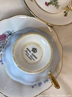 Bottom view of Royal Albert blue teacup showing maker's mark with crown and England origin