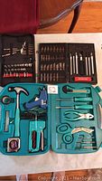 Top view of three assorted tool kits arranged showing contents: allen key and socket set, precision blade utility knife set, handyman kit in teal case
