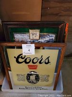 Coors Premium mirror in oak frame at front of stacked mirrors