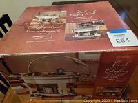 Top of original box showing picture and product details of the 4.2 quart oval chafing dish.
