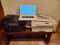 Acer Chromebook open on table with Epson printer to left and Xerox copy machine to right