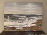 Front view showing the full canvas artwork of the ocean scene with crashing waves.