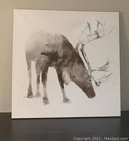Front view of the canvas art showing a deer with large antlers in monochromatic tones, on a white background.