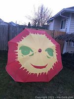 Tent interior showing large sun face design