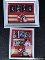 Overview of two silver-tone framed displays holding Chiefs trading cards