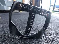 Close-up of the black putter head showing model details including SIGMA NCX RAY and NEVER COMPROMISE branding