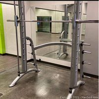 Partially assembled smith machine frame in gym setting