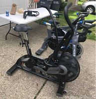 Side view of bike showing fan-blade housing, frame and missing belt on drive side