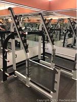 Front-facing view of assembled power rack frame in gym environment