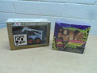 Photo showing both the Bobcat model loader box and the sealed music card set side by side.