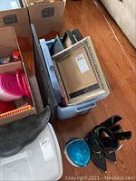 Bin full of assorted frames including collage and single-photo frames showing variety in style and color