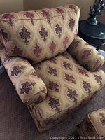 Front view of the Thomasville swivel armchair showing plush seat, back, and armrest cushions with patterned upholstery.