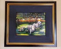 Frontal view of framed oil painting showing forest scene with tree stumps