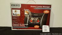Boxed Homedics Shiatsu Lumbar Massager showing product image, features including rotating massage mechanism and heat function, box measures 10.5" x 15".