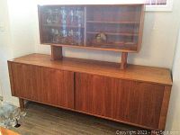 Full front view of teak buffet and hutch
