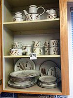 Full set arranged on shelves showing all pieces