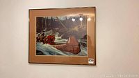 Framed art print showing a Mountie in a red canoe in rapids with forest background, signed by A. Friberg