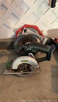 Photo showing Talsmann circular saw with round blade and a separate circular saw blade in red packaging.