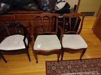 Set of three chairs including two wooden chairs and one black lacquered armchair