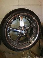 Front view of BMW alloy rim mounted with tire showing overall condition and BMW center cap.