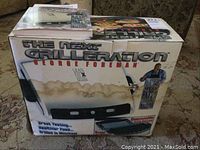 Original George Foreman grill in box showing water damage on box front