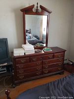 Photo showing the full dresser with mirror attached, items on dresser top included but not part of sale.