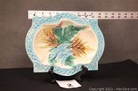Front view of the rectangular Majolica plate showing aqua basket weave border and colorful leaf pattern with ruler indicating size