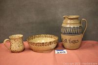 Photo showing all three pottery pieces - pitcher on right, bowl center, mug left, all with splatter glaze