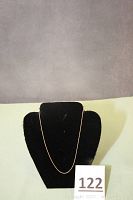 Full view of delicate rope chain necklace displayed on black bust.