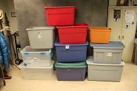 Front view showing all 10 bins stacked in two columns with various colors and some lids visible.