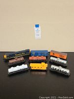 All model train cars and locomotive arranged in one group