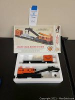 Full set in original box including crane car and boom tender in foam insert.
