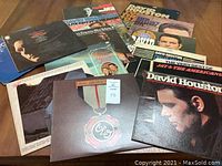 Photo showing 12 vintage vinyl LP records with colorful covers, featuring David Houston and Jay and the Americans.