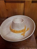 Photo of beige ceramic party hat dish with tan band detail, for chips and salsa serving, showing top and side profile of dish.