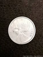 1958 Canadian silver coin tail side with caribou and date 1958