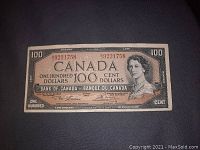 Front of 1954 $100 Canadian banknote showing Queen Elizabeth II portrait and serial number BJ9221758