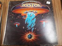 Front cover of Boston vinyl record album showing the spaceship guitar artwork and exploding planet