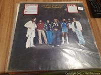 Photo of Lynyrd Skynyrd Street Survivors vinyl record cover showing the band members and album title