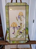Full front view of the stained glass frame with the watercolor floral artwork and lace inserts.