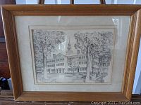 Framed pencil sketch print of Dartmouth Hall with surrounding trees showing overall condition, frame, and matting.