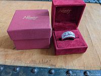 Affinity Diamonds original outer and inner red boxes with ring displayed inside.
