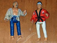 Front view of Mr. Miyagi and Daniel Larusso action figures showing costume and head details