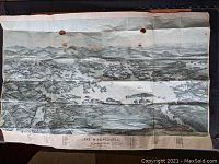 Full view of the vintage bird's eye view map of Lake Winnipesaukee showing entire map with visible holes and fold lines.
