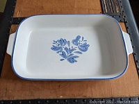 Top view of the Pfaltzgraff Yorktowne casserole pan showing blue floral pattern on white ceramic base with blue rim and handles.