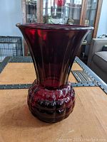 Front view of the royal ruby red pineapple vase showing the full shape including flared top and textured base.